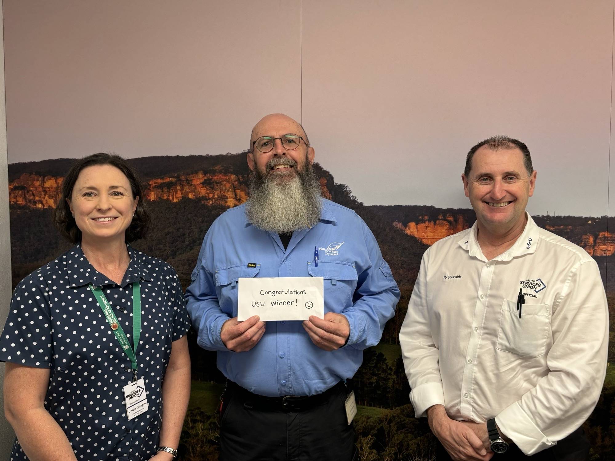 Wollongong City Council USU member, Narelle McKenzie receiving her member portal competition prize from USU Organiser Aarron Vann.