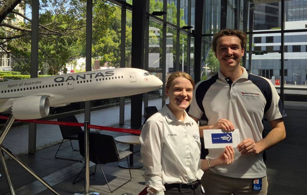 Wollongong City Council USU member, Narelle McKenzie receiving her member portal competition prize from USU Organiser Aarron Vann.