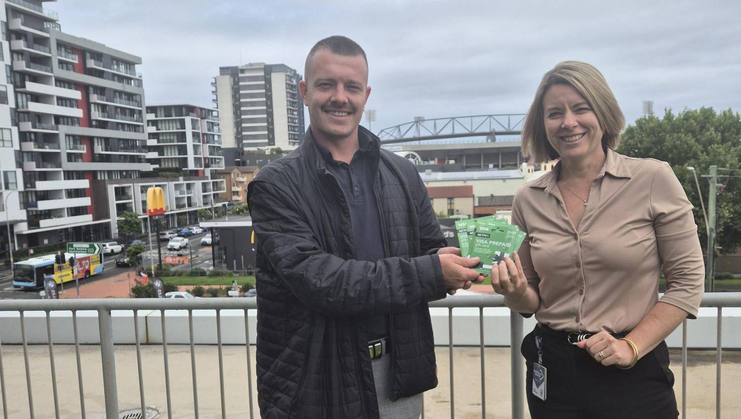 Wollongong City Council USU member, Narelle McKenzie receiving her member portal competition prize from USU Organiser Aarron Vann.